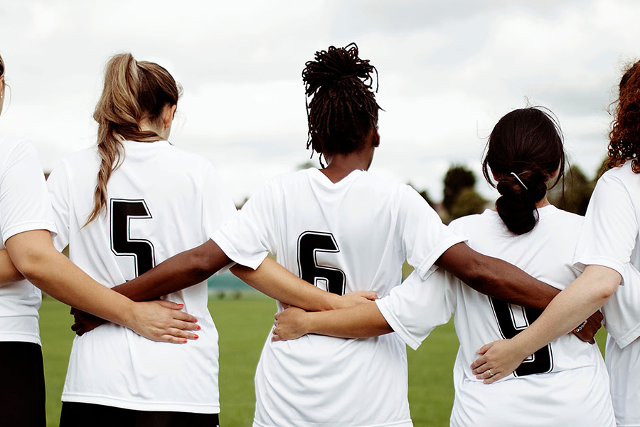 soccer players in a huddle